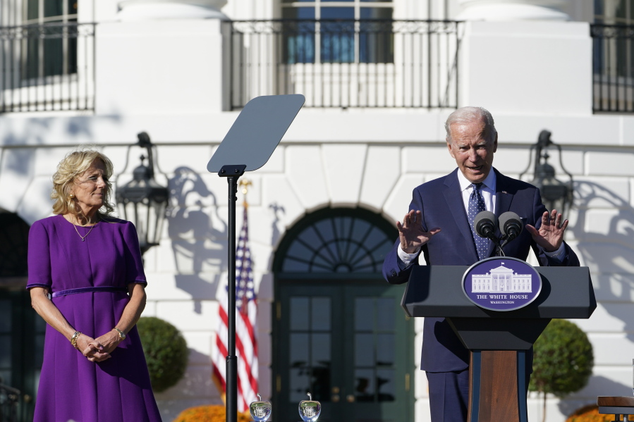 First lady Jill Biden, left, listens as President Joe Biden, right, speaks to the 2020 and 2021 State and National Teacher of the Year recipients during an event on the South Lawn of the White House in Washington, Monday, Oct. 18, 2021.