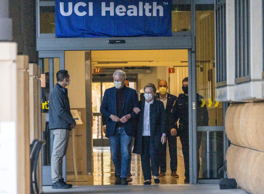Former President Bill Clinton and former U.S. Secretary of State Hillary Clinton leave the University of California Irvine Medical Center in Orange, Calif., Sunday, Oct. 17, 2021. He was released after being treated for an infection and will head home to New York to continue his recovery, a spokesman said.