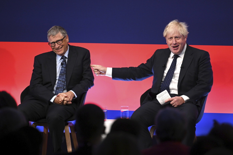 Britain's Prime Minister Boris Johnson, right, appears on stage in conversation with American Businessman Bill Gates during the Global Investment Summit at the Science Museum, London, Tuesday, Oct, 19, 2021.