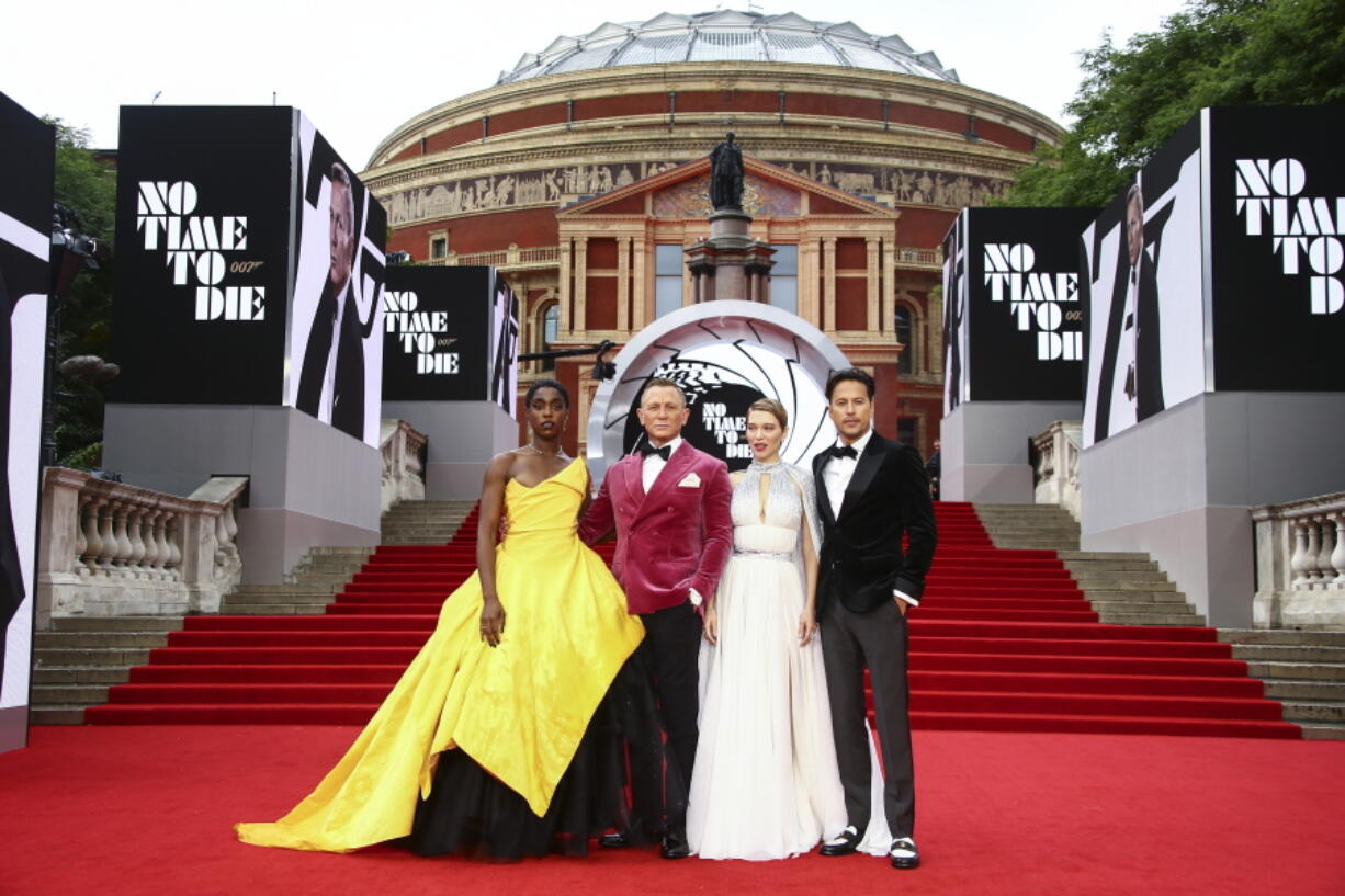 Lashana Lynch, from left, Daniel Craig, Lea Seydoux and Cary Joji Fukunaga pose for photographers upon arrival for the World premiere of the new film from the James Bond franchise 'No Time To Die', in London Tuesday, Sept. 28, 2021.