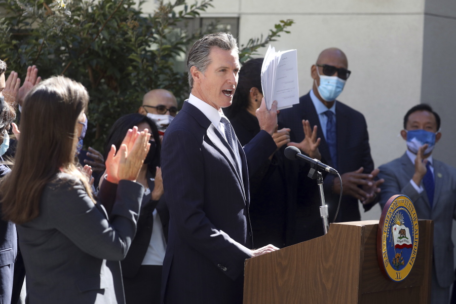 California Gov. Gavin Newsom speaks at a news conference to sign a number of housing bills at the Coliseum Connections apartment complex in Oakland, Calif., Tuesday, Sept. 28, 2021. Newsom signed seven new laws aimed at addressing the state's homeless crisis during an event in Los Angeles, on Wednesday, Sept. 29.