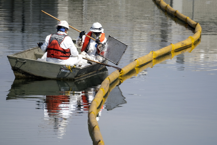 Crews continue to clean the oil in the Wetlands Talbert Marsh after an oil spill in Huntington Beach, Calif., on Huntington Beach, Calif., on Monday, Oct. 4, 2021. A major oil spill off the coast of Southern California fouled popular beaches and killed wildlife while crews scrambled Sunday, to contain the crude before it spread further into protected wetlands. (AP Photo/Ringo H.W.