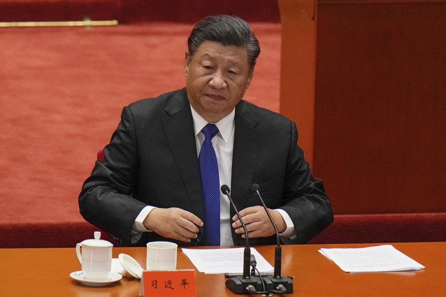 Chinese President Xi Jinping looks as he arrives at an event commemorating the 110th anniversary of Xinhai Revolution at the Great Hall of the People in Beijing, Saturday, Oct. 9, 2021. Xi said on Saturday reunification with Taiwan must happen and will happen peacefully, despite a ratcheting-up of China's threats to attack the island.