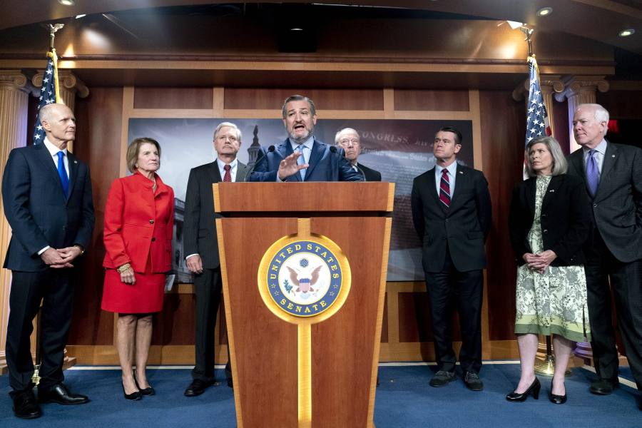 FILE - In this Oct. 6 2021, file photo Sen. Ted Cruz, R-Texas, accompanied by from left, Sen. Rick Scott, R-Fla., Sen. Shelley Moore Capito, R-W.Va., and Sen. John Hoeven, R-N.D., Sen. Chuck Grassley, R-Iowa, Sen. Todd Young, R-Ind., Sen. Joni Ernst, R-Iowa, and Sen. John Cornyn, R-Texas, speaks at a news conference on Capitol Hill in Washington to speak about immigration at the U.S.- Mexico boarder. About 36% of President Joe Biden's nominees have been confirmed by the Senate so far in the evenly divided Senate, a deterioration from the paltry 38% success rate that former President Donald Trump saw at the same stage of his presidency.
