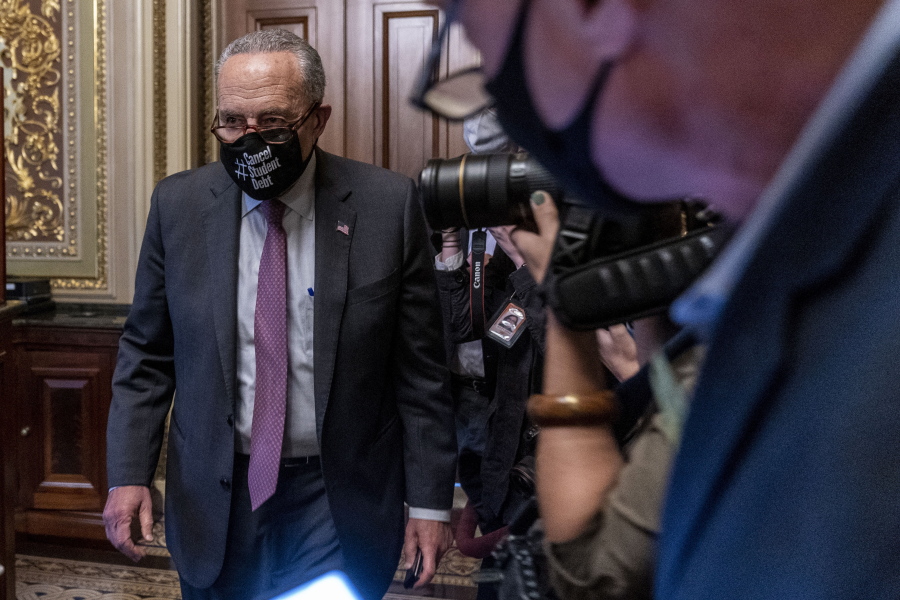 Senate Majority Leader Sen. Chuck Schumer of N.Y., leaves a Senate Democratic meeting at the Capitol in Washington, Wednesday, Oct. 6, 2021, as a showdown looms with Republicans over raising the debt limit.