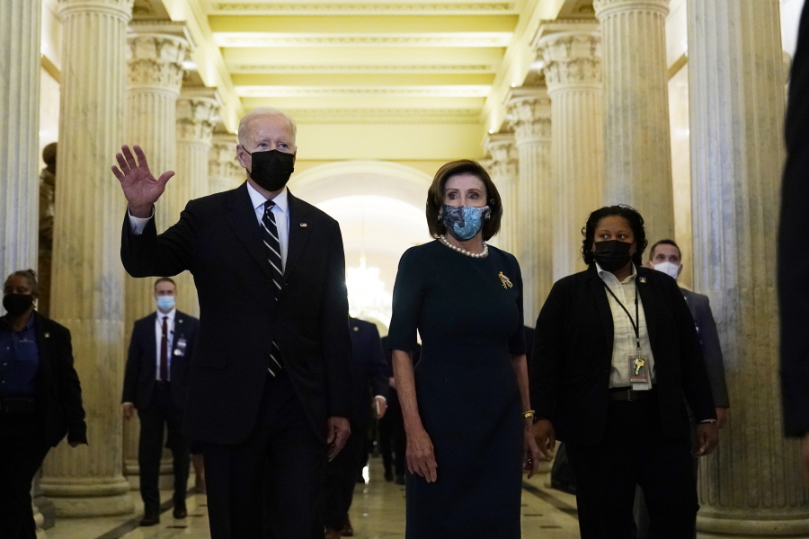 President Biden walks with House Speaker Nancy Pelosi on Capitol Hill in Washington, Thursday, Oct. 28, 2021, following a visit to meet with House Democrats.