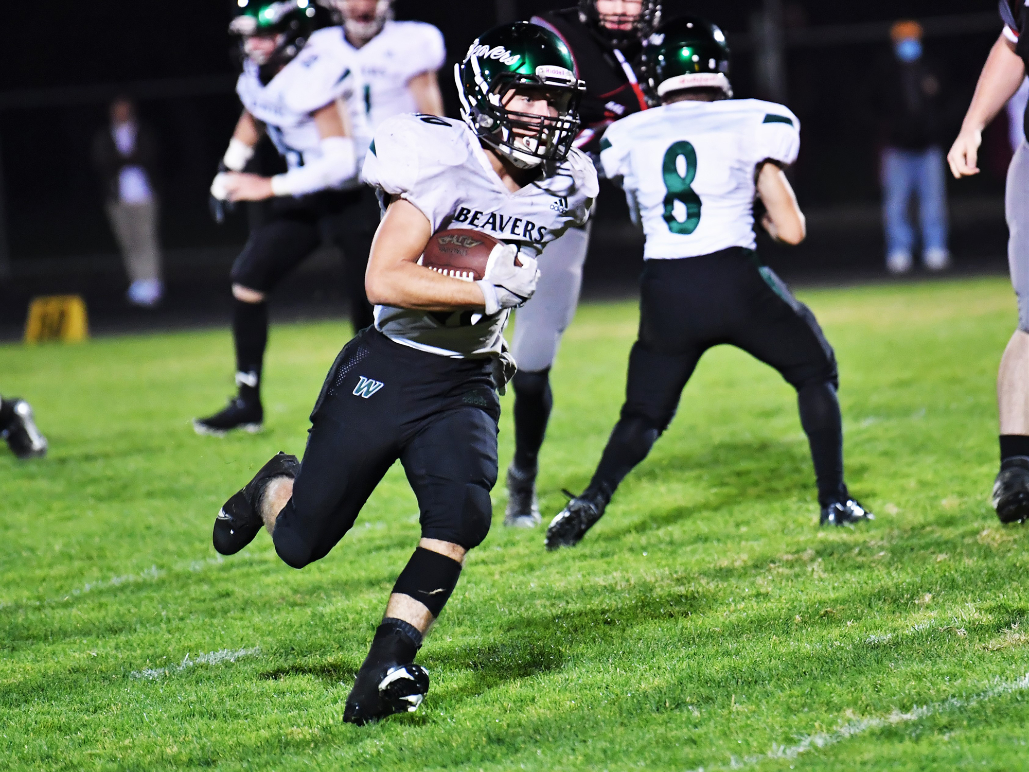 Dalton Beassie carries the ball in Woodland's 8-7 win over R.A. Long at Longview Memorial Stadium on Oct. 8. Beassie finished with 104 yards and a touchdown on 21 carries.
