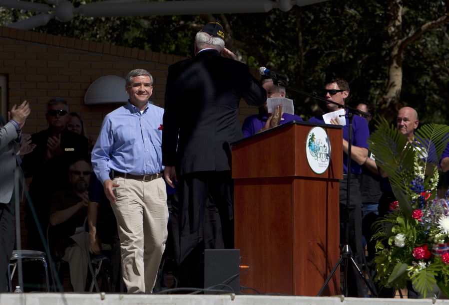 FILE - Blackhawk pilot Michael Durant, who was held prisoner in Somalia, is welcomed to the podium during Bonita Springs' Veterans Day memorial service at Riverside Park in Bonita Springs, Fla., in this Tuesday, Nov. 11, 2014, file photo. Mike Durant, best known as the helicopter pilot shot down and held prisoner in the 1993 "Black Hawk Down" incident, is joining the U.S. Senate race in Alabama. Durant, now the founder and president of an aerospace company in Huntsville, announced his campaign Tuesday, Oct. 19, 2021.