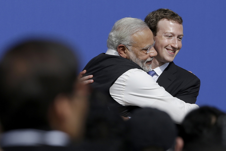 FILE - In this  Sept. 27, 2015, file photo, Facebook CEO Mark Zuckerberg, right, hugs Prime Minister of India Narendra Modi at Facebook in Menlo Park, Calif.. Facebook in India has been selective in curbing hate speech, misinformation and inflammatory posts, particularly anti-Muslim content, according to leaked documents obtained by The Associated Press, even as the internet giant's own employees cast doubt over the motivations and interests.