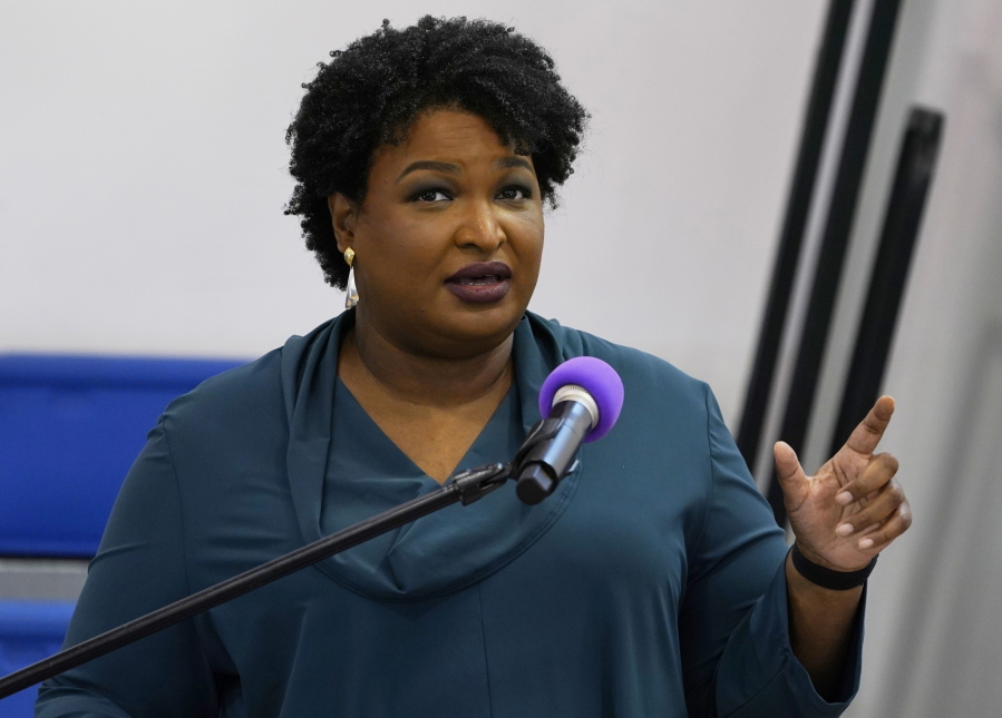 FILE - Stacey Abrams speaks during a church service in Norfolk, Va., Sunday, Oct. 17, 2021. A political organization led by the Democratic titan is branching out into paying off medical debts. Fair Fight Action on Wednesday, Oct. 27 told The Associated Press that it is donating $1.34 million from its political action committee to wipe out debt owed by 108,000 people in Georgia, Arizona, Louisiana, Mississippi and Alabama.