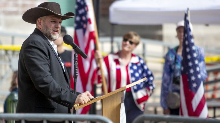 FILE - In this April 3, 2021, file photo, Ammon Bundy speaks to a crowd of about 50 followers in front of the Ada County Courthouse in downtown Boise. A far-right group launched the anti-government activist Bundy is rapidly expanding nationwide and making inroads into Canada, according to a new report from the Institute for Research and Education on Human Rights.