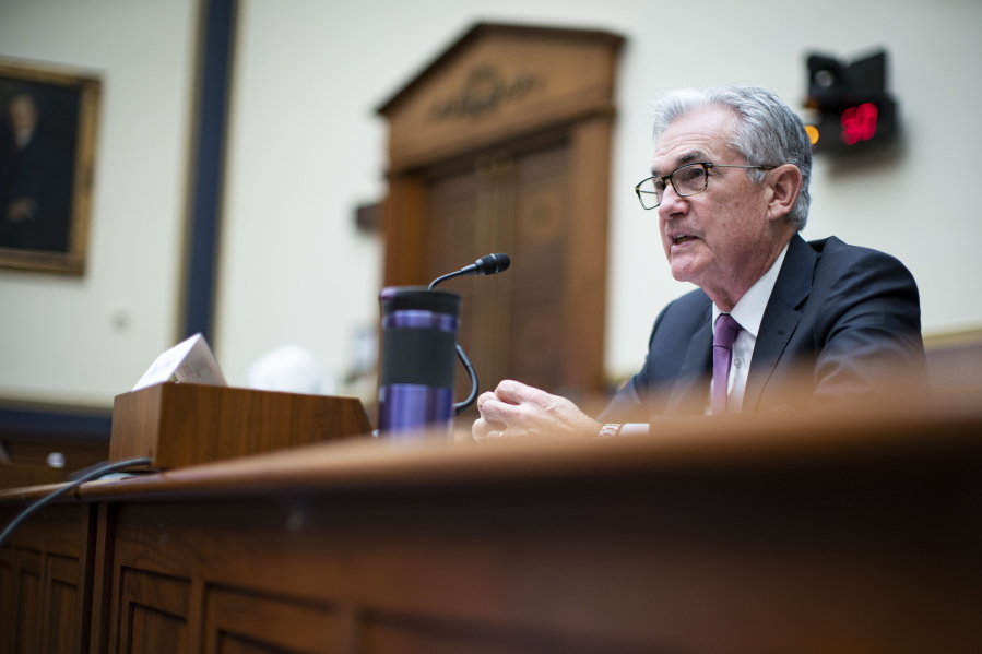 FILE - In this Sept. 30, 2021 file photo, Federal Reserve Chairman Jerome Powell testifies during a House Financial Services Committee hearing on Capitol Hill in Washington.   Federal Reserve officials agreed at their last meeting that if the economy continued to improve, they could start reducing their monthly bond purchases as soon as next month and bring them to an end by the middle of 2022. The discussion was revealed in the minutes of the Fed's Sept. 21-22 meeting, released Wednesday., Oct. 13.