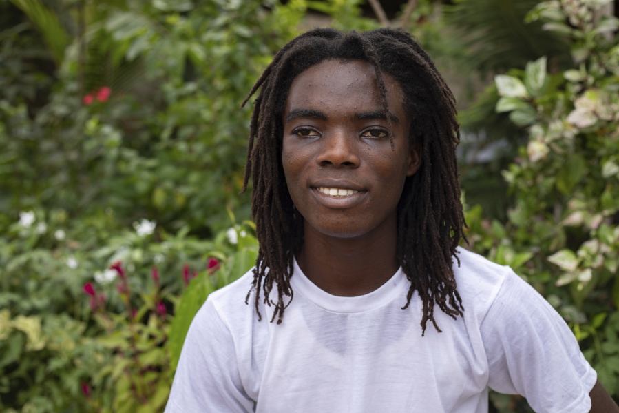 Tyrone Iras Marhguy, 17, pose for a photograph at his home in Accra, Ghana, Sunday, Oct. 10, 2021. An official at the academically elite Achimota School in Ghana told the teen he would have to cut his dreadlocks before enrolling. For Marhguy, who is a Rastafarian, cutting his dreadlocks is non-negotiable so he and his family asked the courts to intervene.