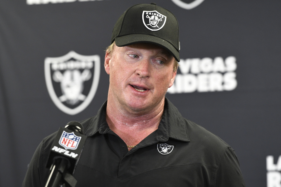 FILE - In this Sept. 19, 2021, file photo, Las Vegas Raiders head coach Jon Gruden meets with the media following an NFL football game against the Pittsburgh Steelers in Pittsburgh. Gruden is out as coach of the Raiders after emails he sent before being hired in 2018 contained racist, homophobic and misogynistic comments. A person familiar with the decision said Gruden is stepping down after The New York Times reported that Gruden frequently used misogynistic and homophobic language directed at Commissioner Roger Goodell and others in the NFL.