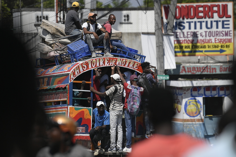Commuters ride a Tap Tap bus in Port-au-Prince, Haiti, Wednesday, Oct. 20, 2021.