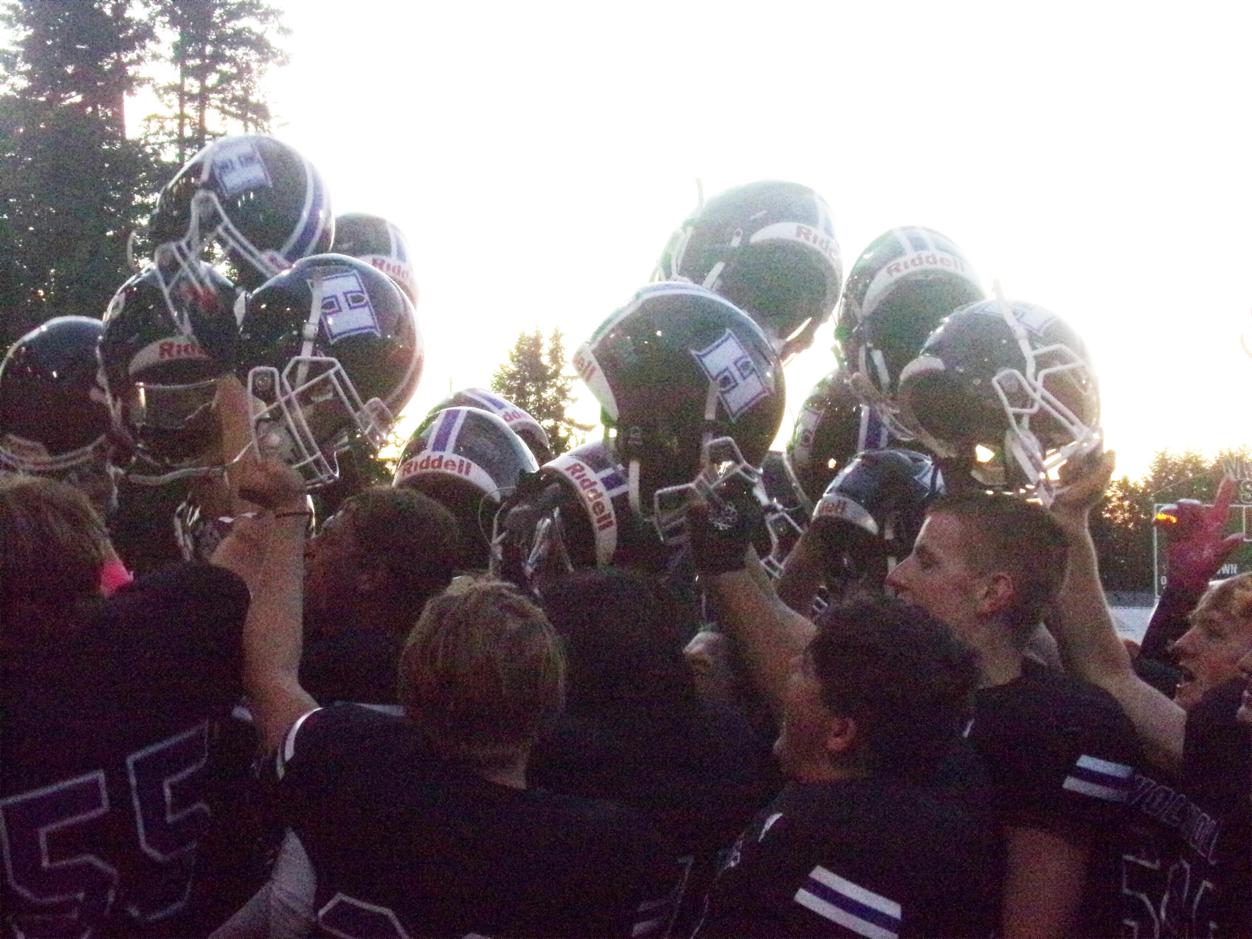 Heritage football players celebrate their 16-13 win over Evergreen on Thursday, Oct.