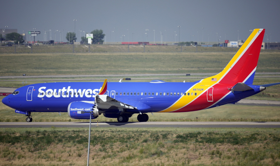 FILE - In this July 2, 2021, file photo, a Southwest Airlines jetliner taxis down a runway for take off from Denver International Airport in Denver. Southwest Airlines canceled hundreds more flights Monday, Oct. 11, 2021 following a weekend of major service disruptions. By midmorning Monday, Southwest had canceled about 360 flights and more than 600 others were delayed.