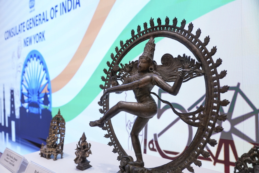 Some of the stolen objects being returned to India, including this bronze Shiva Nataraja valued at $4 million, are displayed during a ceremony at the Indian consulate in New York, Thursday, Oct. 28, 2021. U.S. authorities have returned about 250 antiquities to India in a long-running investigation of a stolen art scheme. The items, worth an estimated $15 million, were handed over on Thursday during a ceremony at the Indian consulate in New York City.