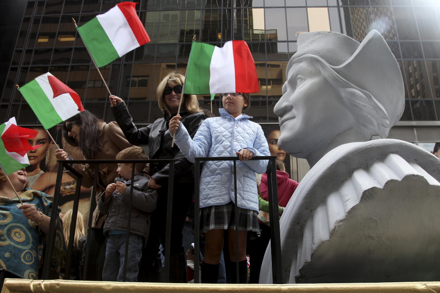 FILE - In this Oct. 8, 2012 file photo, people ride on a float with a large bust of Christopher Columbus during the Columbus Day parade in New York.  Monday, Oct.