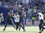 Seattle Seahawks quarterback Geno Smith (7) throws against the Jacksonville Jaguars during the first half of an NFL football game, Sunday, Oct. 31, 2021, in Seattle. (AP Photo/Ted S.
