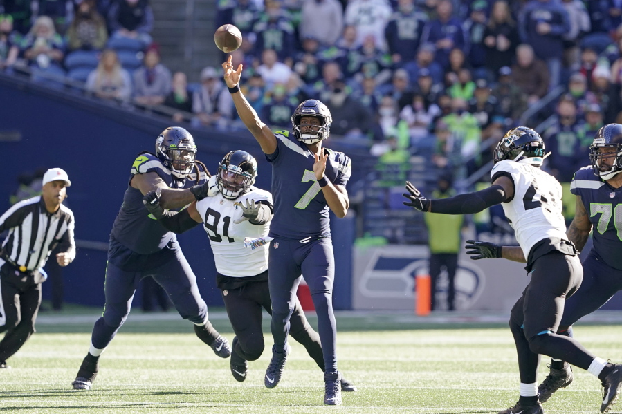 Seattle Seahawks quarterback Geno Smith (7) throws against the Jacksonville Jaguars during the first half of an NFL football game, Sunday, Oct. 31, 2021, in Seattle. (AP Photo/Ted S.