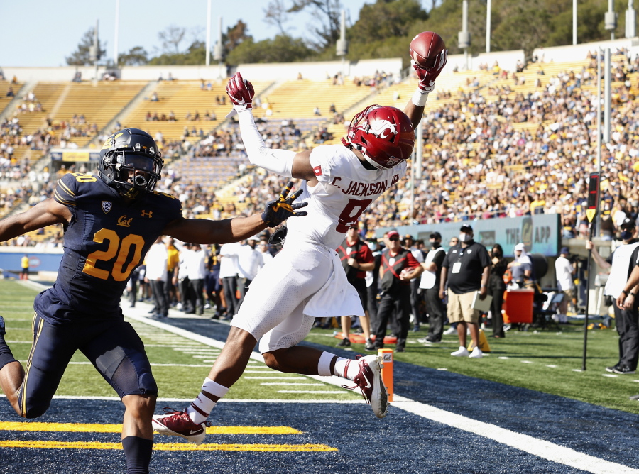 Washington State Cougars wide receiver Calvin Jackson Jr. (8) catches a touchdown pass in front of California Golden Bears cornerback Josh Drayden (20) in the first quarter during an NCAA football game on Saturday, Oct. 2, 2021 in Berkeley, Calif.