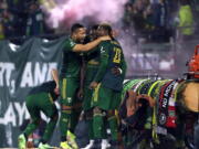 Portland Timbers forward Dairon Asprilla (27) celebrates with teammates after his goal during an MLS soccer game against the San Jose Earthquakes Wednesday, Oct. 27, 2021 in Portland, Ore.