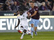 Portland Timbers forward Yimmi Chara (23) moves the ball against Colorado Rapids defender Keegan Rosenberry (2) during an MLS soccer match Saturday, Oct. 23, 2021, in Commerce City, Colo.