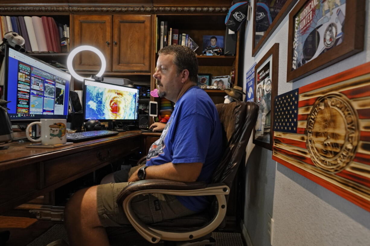 Mike Boylan works in his Oldsmar, Fla., home office. As Hurricane Ida barreled toward Louisiana in August, Boylan hit the road with live reports for his social media followers as he chased the storm.