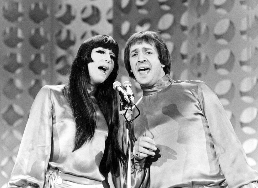 FILE - In this Jan. 21, 1966 file photo, Sonny, right, and Cher sing during a taping of "The Danny Thomas Special" in Los Angeles. Cher has sued the widow of her former musical partner and ex-husband Sonny Bono over royalties for Sonny and Cher songs including "I Got You Babe" and "The Beat Goes On." In a federal lawsuit filed Wednesday, Oct. 13, 2021, Cher alleges that former Rep. Mary Bono and other defendants have attempted to terminate provisions of business agreements Cher and Sonny Bono reached when they divorced in 1975 that entitled each to 50% of songwriting and recording royalties.