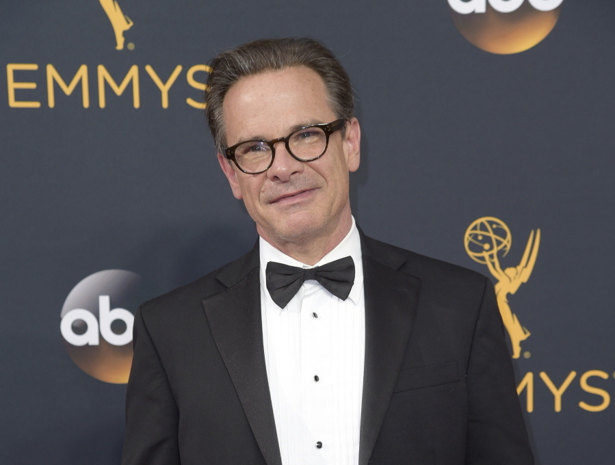 FILE - Peter Scolari arrives at the 68th Primetime Emmy Awards in Los Angeles on Sept. 18, 2016. Scolari, a versatile character actor whose television roles included a yuppie producer on "Newhart" and a closeted dad on "Girls" and who was on Broadway in "Hairspray" and "Wicked," died Friday morning in New York after fighting cancer for two years, according to Ellen Lubin Sanitsky, his longtime manager. He was 66.