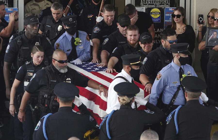 The dignified transfer of the remains of slain Hollywood Police Officer Yandy Chirino takes place at Memorial Regional Hospital in Hollywood, Fla., on Monday Oct. 18, 2021. Chirino was killed during a late-night altercation with a teenage suspect and died at the hospital.