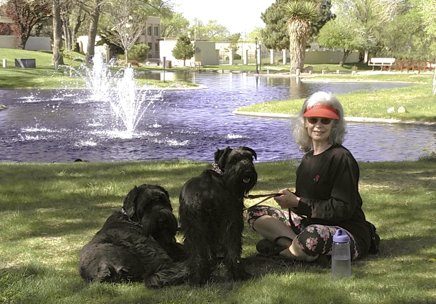 Penny Wagner appears with her two dogs, Clarence, left, and Cooper in Albuquerque, N.M., on April 8, 2020.