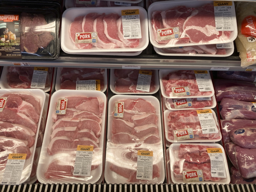 Shown are pork products at a grocery store in Roslyn, Pa., Tuesday, June 15, 2021.  The Labor Department reported Thursday Oct. 14,  that the monthly increase in its producer price index, which measures inflationary pressures before they reach consumers, was 0.5% for September compared to a 0.7% gain in August.