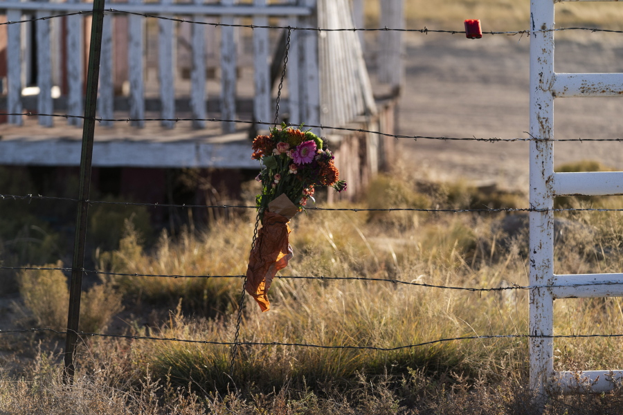 A bouquet of flowers is left to honor cinematographer Halyna Hutchins outside the Bonanza Creek Ranch in Santa Fe, N.M., Sunday, Oct. 24, 2021. Hutchins died after actor Alec Baldwin fired a fatal gunshot from a prop gun that he had been told was safe. (AP Photo/Jae C.