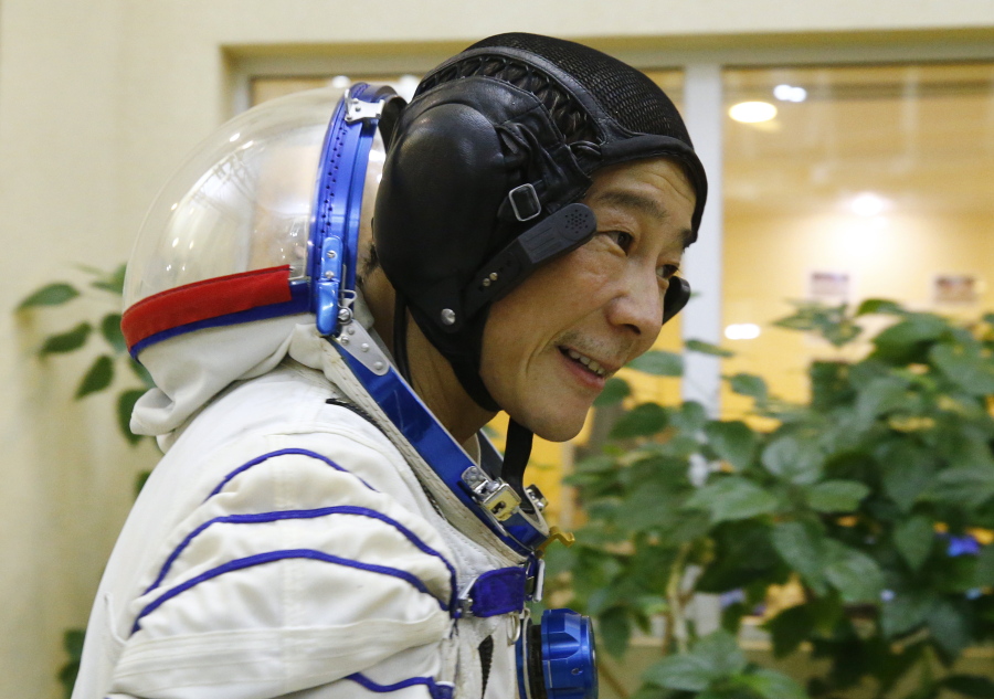 Space flight participant Yusaku Maezawa attends a training session ahead of the expedition to the International Space Station at the Gagarin Cosmonauts' Training Center in Star City outside Moscow, Russia, Thursday, Oct. 14, 2021. A Japanese fashion tycoon who's booked a SpaceX ride to the moon is going to try out the International Space Station first. Yusaku Maezawa announced that he's bought two seats on a Russian Soyuz capsule. He'll blast off in December on the 12-day mission with his production assistant and a professional cosmonaut.