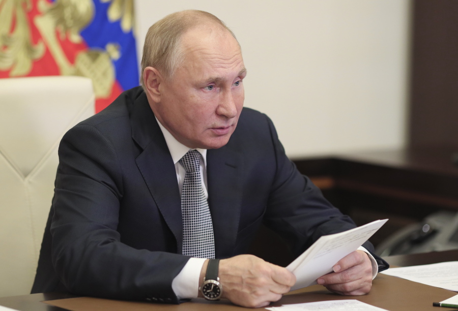 Russian President Vladimir Putin attends a meeting of the State Council Presidium to discuss the country's transport strategy until 2030 via video conference call at the Novo-Ogaryovo state residence, outside Moscow, Russia, Tuesday, Oct. 19, 2021.