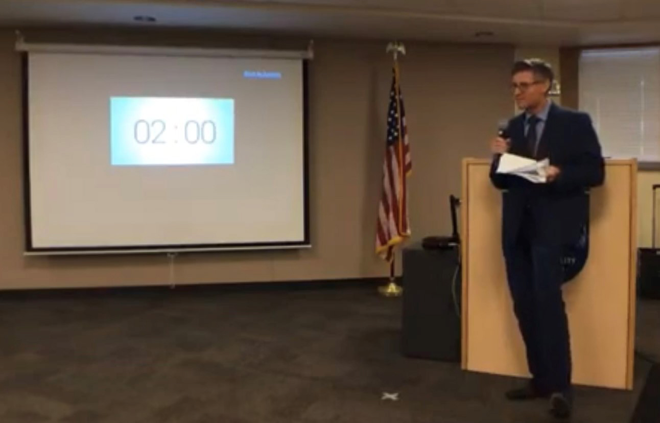 Washougal physician assistant Scott Miller speaks against COVID-19 safety precautions such as mask mandates and distance-learning during a Camas School Board meeting on May 10, 2021.