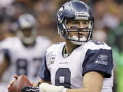 Seattle Seahawks quarterback Matt Hasselbeck looks for a receiver during the second half of an NFL football game against the New Orleans Saints at the Louisiana Superdome in New Orleans, Sunday, Nov. 21, 2010. Hasselbeck seems to hold sharper memories of the tougher times during his long tenure in Seattle than the moments when the Seahawks experienced success. The tougher moments seem to be the ones that have resonated. But that also makes Hasselbeck appreciate the successes he had during his 10 years as quarterback and moments such as Monday, Oct. 25, 2021 when he will be inducted into the Seahawks "Ring of Honor" at halftime of Seattle's matchup with New Orleans.