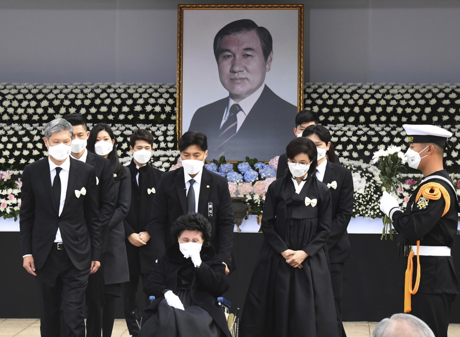 Relatives pay tribute at a memorial altar as they make a call of condolence at the funeral of deceased former South Korean President Roh Tae-woo, Saturday,  Oct. 30, 2021 in Seoul, South Korea. Dozens of relatives and dignitaries gathered in South Korea's capital on Saturday to pay their final respects to the former president, a key participant in a 1979 military coup who later won a landmark democratic election before his political career ended with imprisonment for corruption and treason.