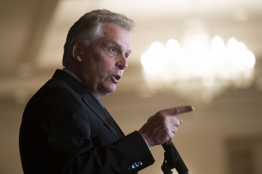 FILE - In this Sept. 1, 2021, file photo, Virginia Democratic gubernatorial candidate Terry McAuliffe addresses the Virginia FREE Leadership Luncheon in McLean, Va. McAuliffe on Tuesday called on leaders in Washington from both parties -- including President Joe Biden -- to "get their act together," while pushing Senate Democrats to scrap the filibuster if needed to enact the party's priorities on infrastructure spending and voting rights.