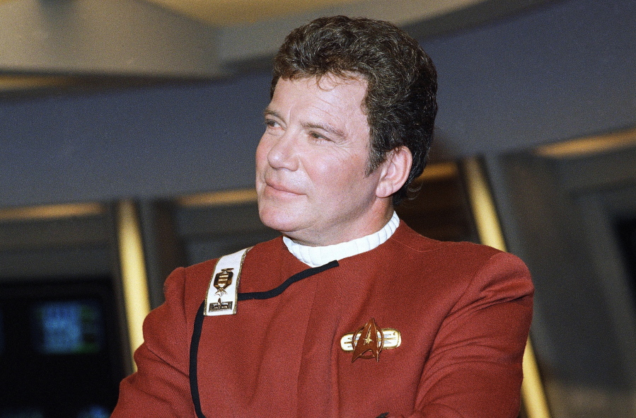 FILE - In this 1988 file photo, William Shatner, who portrays Capt. James T. Kirk, attends a photo opportunity for the film "Star Trek V: The Final Frontier." The performer who breathed life into Kirk is, at age 90, heading toward the stars under dramatically different circumstances than his fictional counterpart when Shatner boards Jeff Bezos' Blue Origin NS-18.