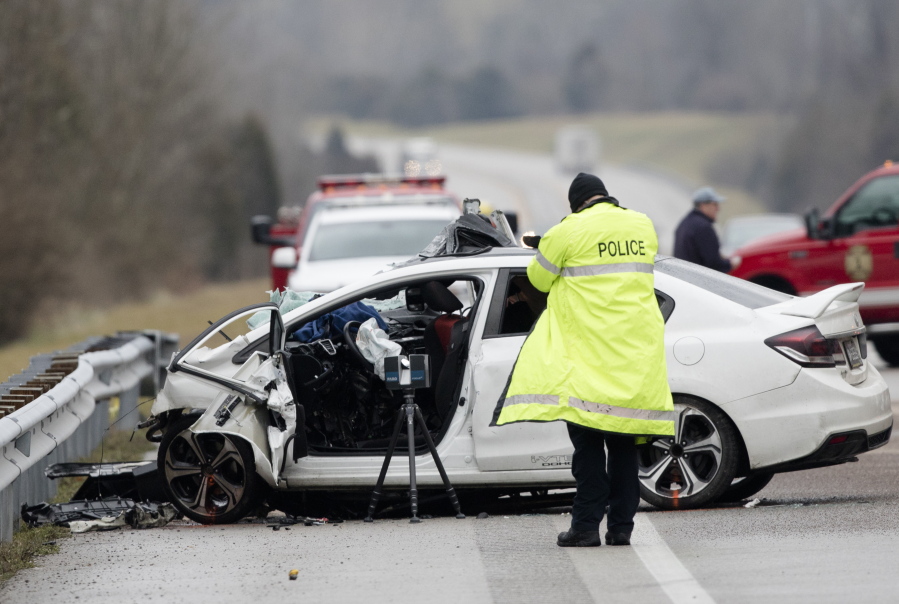 FILE - In this Saturday, Jan. 25, 2020, file photo, emergency crews work the scene of a fatal crash involving a charter bus and car on the AA highway in Campbell County, Ky. The number of U.S. traffic deaths in the first half of 2021 hit 20,160, the highest first-half total since 2006, the government reported Thursday, Oct.