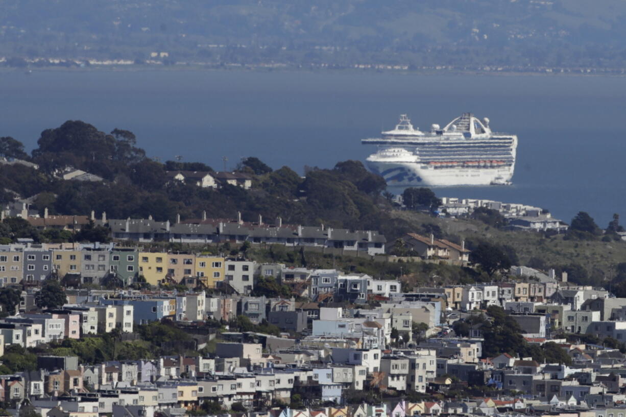 FILE - In this March 31, 2020, file photo, the Grand Princess cruise ship, carrying crew and passengers struck with the coronavirus, is shown in San Francisco. Cruise ships are returning to San Francisco after a 19-month hiatus brought on by the pandemic in what's sure to be a boost to the city's economy, the mayor announced Friday, Oct. 8, 2021.
