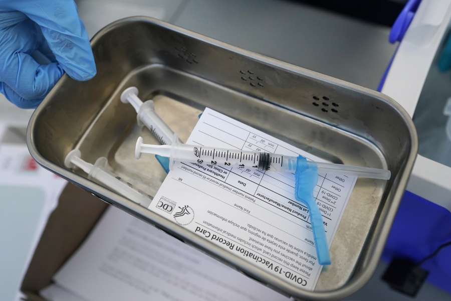 FILE - This May 13, 2021, file photo shows syringes filled with the Johnson & Johnson vaccine at a mobile vaccination site in Miami. Police departments that are requiring officers to be vaccinated against COVID-19 are running up against pockets of resistance across the U.S.