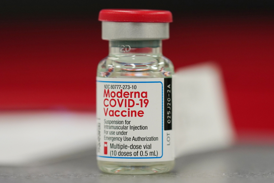 FILE - This Dec. 23, 2020 file photo shows a vial of the Moderna COVID-19 vaccine in the first round of staff vaccinations at a hospital in Denver. Federal regulators are expected to authorize the mixing and matching of COVID-19 booster shots this week in an effort to provide flexibility for those seeking to maintain protection against the coronavirus. The upcoming announcement by the Food and Drug Administration is likely to come along with authorization for boosters of the Moderna and Johnson & Johnson shots.