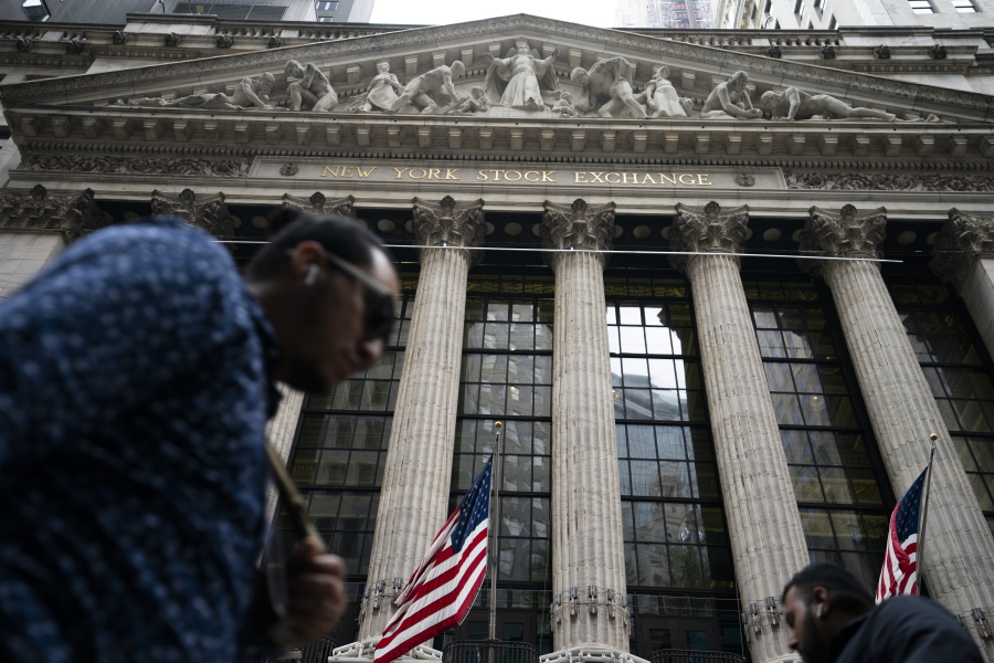 Pedestrians pass the New York Stock Exchange, Monday, Oct. 4, 2021, in New York.  U.S. stocks are opening mixed on Friday, Oct.