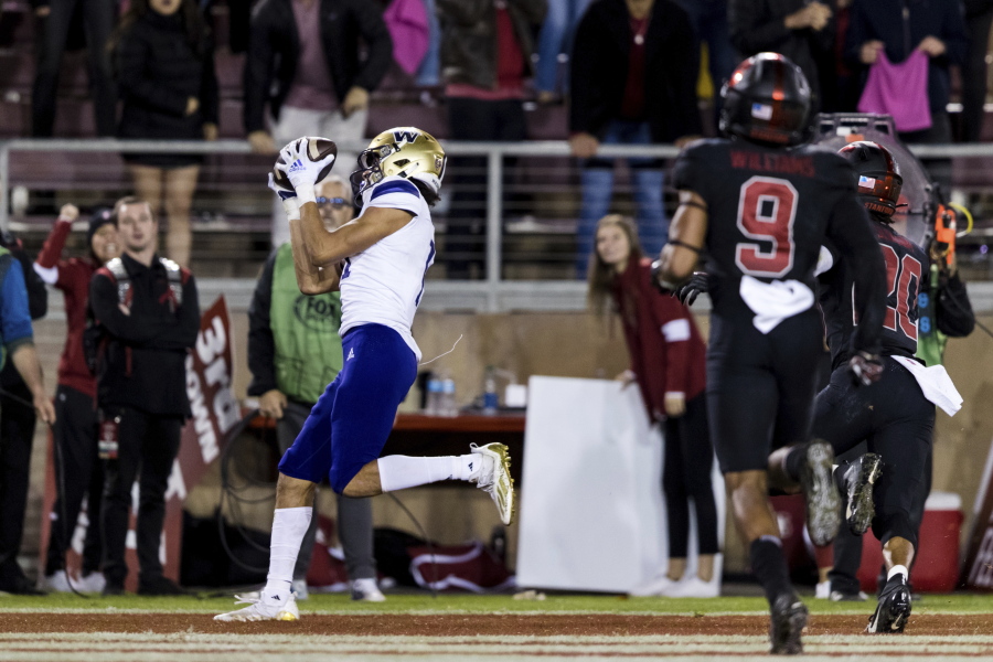 Washington wide receiver Jalen McMillan, left, catches a touchdown pass against Stanford during the fourth quarter of an NCAA college football game in Stanford, Calif., Saturday, Oct. 30, 2021. Washington won 20-13.