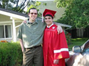 Damien Wheeler and his longtime friend and mentor, Shawn Hamburg, celebrate Wheeler's graduation together.