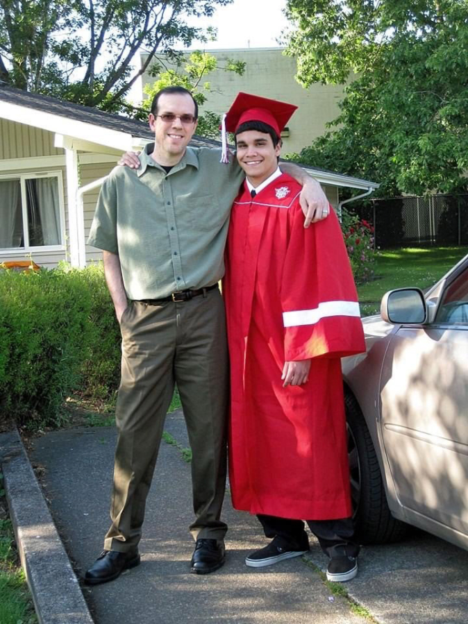 Damien Wheeler and his longtime friend and mentor, Shawn Hamburg, celebrate Wheeler's graduation together.
